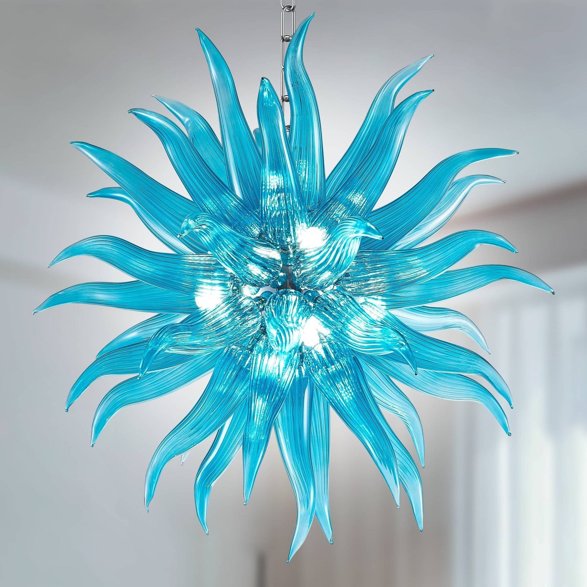 Modern Style Blown Glass Chandelier Aqua Pazzo, featuring vibrant aqua hues for a bold and contemporary look.